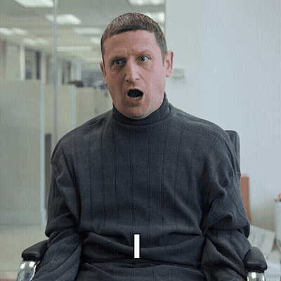Man In Grey Sweater With Letter I On Shirt GIF