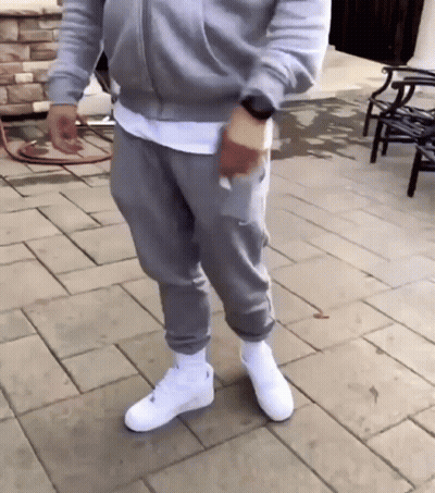 Man In Grey Sweatpants And White Nike Air Force 1 GIF