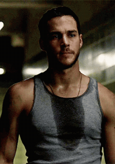 Man In Grey Tank Top Sweating GIF