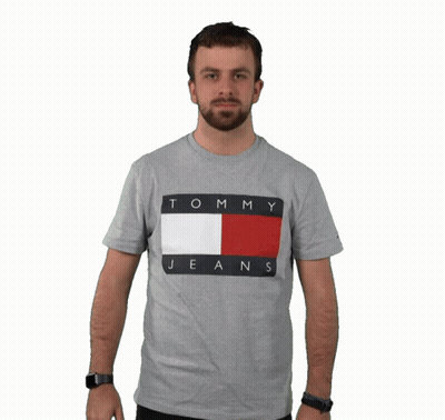 Man In Grey Tommy Hilfiger Shirt Holding It Up GIF