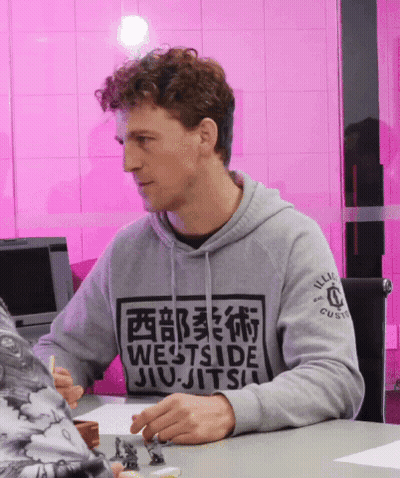 Man In Grey Westside Jiu-Jitsu Sweatshirt At Table GIF
