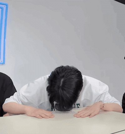 Man In GS Sweatshirt Covering Face GIF