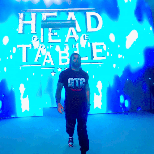 Man In GTC Shirt Walking Past Blue Screen GIF
