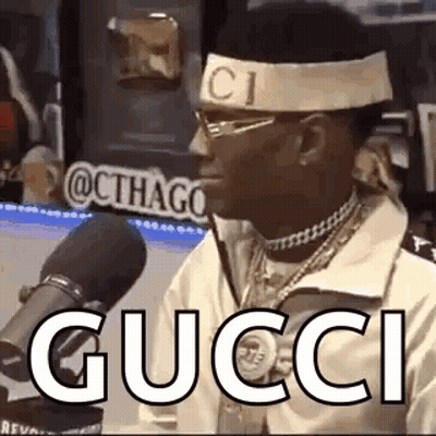 Man In Gucci Headband At Microphone GIF