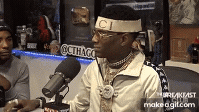 Man In Gucci Headband Sitting At Microphone GIF