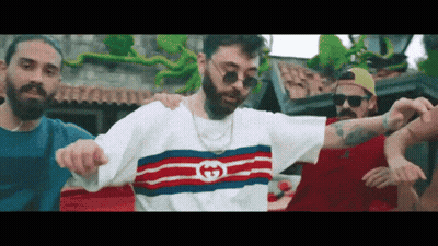 Man in Gucci Shirt Dancing With Group