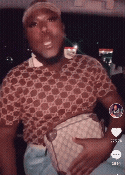 Man In Gucci Shirt Holding White Purse GIF