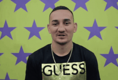 Man In Guess Shirt With Green Purple Background GIF