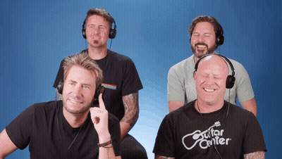 Man In Guitar Center T-Shirt Smiling GIF