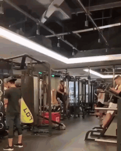 Man In Gym With Bag Saying Lot GIF