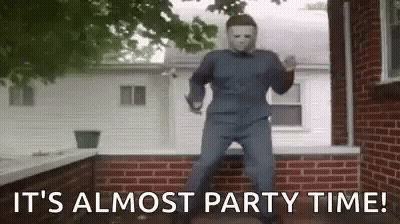 Man In Halloween Costume Dancing In Front Of Brick Wall GIF
