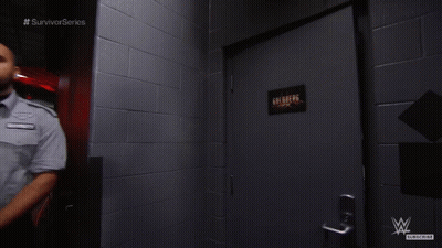Man In Hallway With Survivor Series Text GIF
