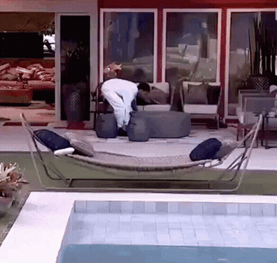 Man In Hammock By Pool GIF