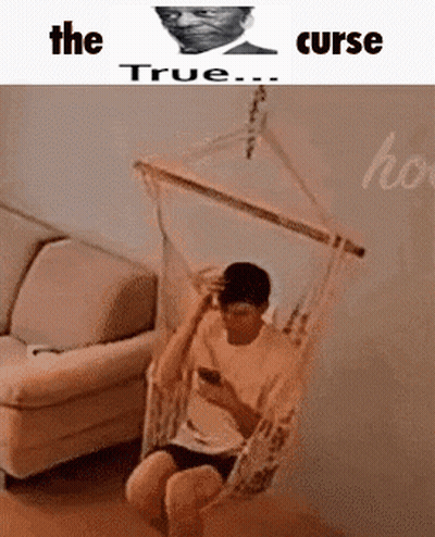 Man In Hammock In Living Room On Phone GIF
