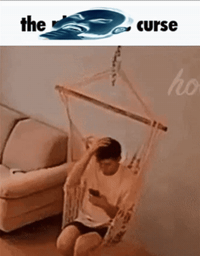 Man In Hammock On Phone Saying The Curse GIF