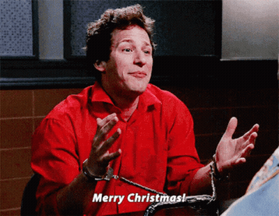 Man In Handcuffs Says Merry Christmas In Red Shirt GIF