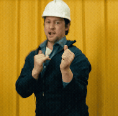 Man In Hard Hat And Blue Jacket Making Funny Face GIF