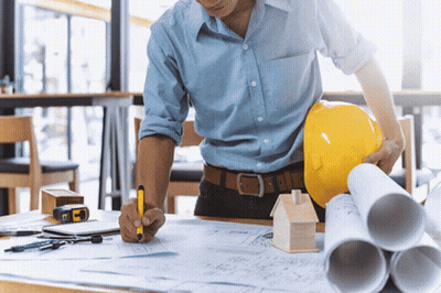 Man In Hard Hat And Blue Shirt Writing On Paper GIF