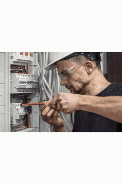 Man In Hard Hat And Safety Glasses Working On Circuit Board GIF