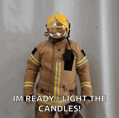 Man In Hard Hat And Suspenders Holding Stick In Front Of Yellow Blippi Building GIF