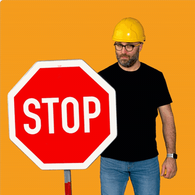 Man In Hard Hat Holding Stop Sign GIF