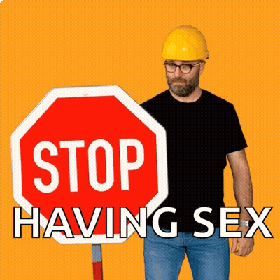 Man In Hard Hat Next To Stop Sign Saying Stop Having Sex GIF
