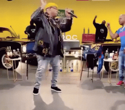 Man In Hard Hat Singing Into Microphone Dancing GIF