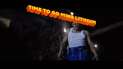 Man In Hard Hat Under Lithium Sign GIF