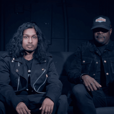 Man In Harley Davidson Hat Beside Man In Black Jacket GIF