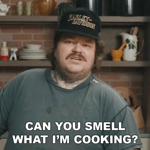 Man In Harley Davidson Hat Smell What He Is Cooking GIF