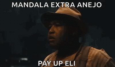 Man In Hat And Backpack Standing In Dark Room GIF
