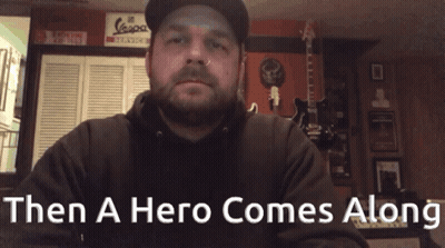 Man In Hat And Black Hoodie Saying Then A Hero Comes Along GIF
