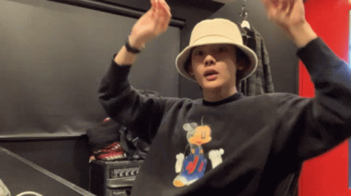 Man In Hat And Black Mickey Mouse Shirt GIF