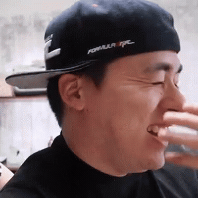 Man In Hat And Black Shirt Laughing GIF
