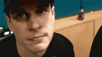 Man In Hat And Black Shirt Making Face GIF