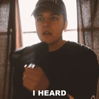 Man In Hat And Black Shirt Saying I Heard GIF