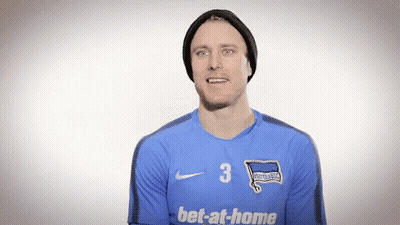 Man In Hat And Blue Jersey Saying Bet-At-Home GIF