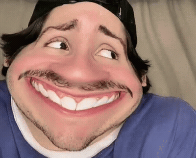 Man In Hat And Blue Shirt Making Funny Face GIF