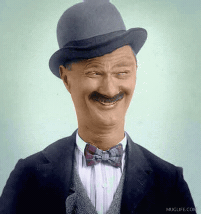 Man In Hat And Bow Tie Smiling GIF
