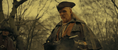 Man in Hat and Cape Holding Sword