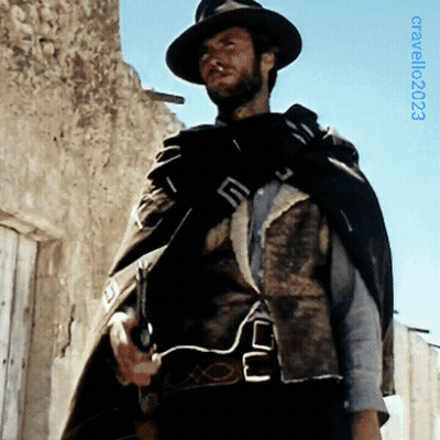 Man In Hat And Cape In Front Of Building With 2003 GIF