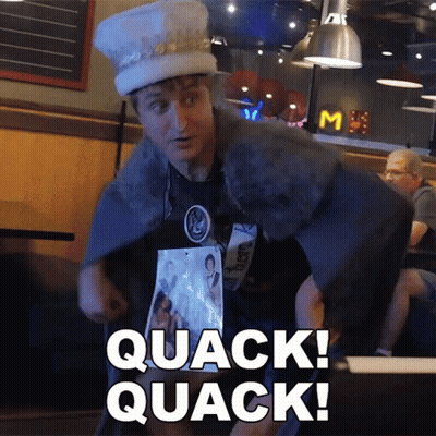 Man In Hat And Cape Saying Quack GIF