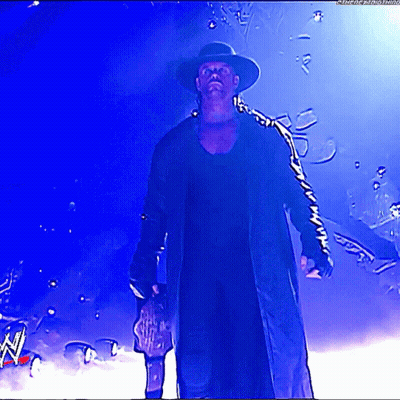 Man In Hat And Coat Holding Trophy GIF