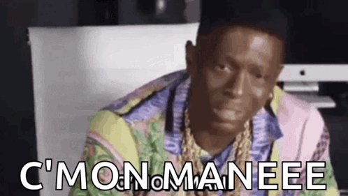 Man In Hat And Colorful Shirt Sitting At Computer Making Funny Face GIF