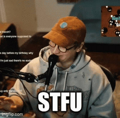 Man In Hat And Glasses At Microphone With STFU Text GIF