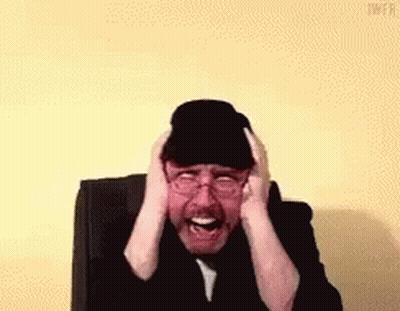 Man In Hat And Glasses Covering Ears GIF