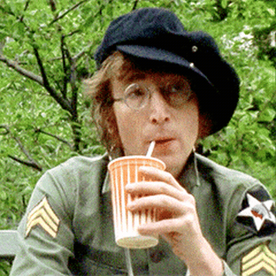 Man In Hat And Glasses Drinking From Orange Cup GIF