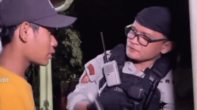 Man In Hat And Glasses Talking To Police Officer GIF