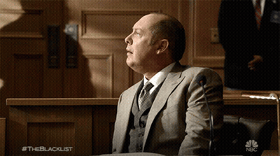 Man In Hat And Glasses Talks To Woman #Theblacklist GIF