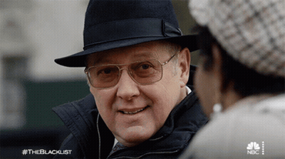 Man In Hat And Glasses Talks To Woman #Theblacklist GIF